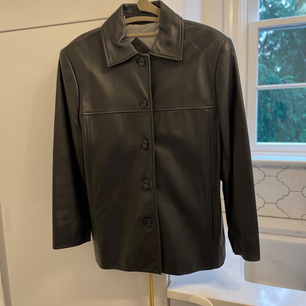 Never worn  M black Leather petite jacket.